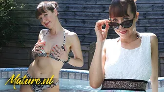 Classy redhead mature woman fingers her dripping wet pussy in the hot tub