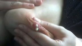 My nasty wife pees and milks her big tits in a car