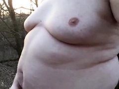 Chubby masturbates in the woods
