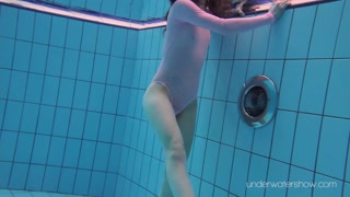 Roxalana Cheh wearing pink dress in the pool