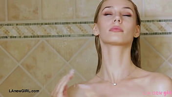 Elegant shy blonde took a shower