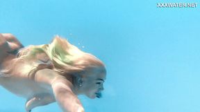 Sexy milf Lisi enjoys a naked swim in the pool