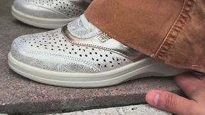 My neighbor crushes my hand with her sneakers
