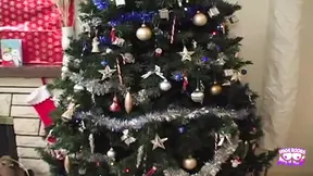 Brown-haired babe fucks bald guy near Christmas tree