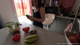 Hot milf puts a zucchini in her pussy for dinner