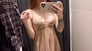 Redhead milf flashes pussy under a dress without panties in red lingerie