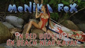 hot monika fox in red bodysuit on beach near kayak