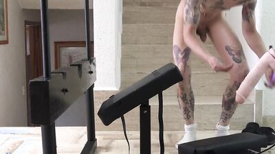 Tattooed and skinny guy bent over and pounded by a fucking machine