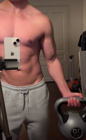 Shirtless Young Bodybuilder Training His Biceps