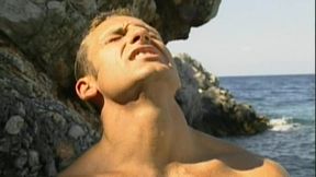 Two Hung Muscle Studs Pound a Young Jock Anal on the Sand in