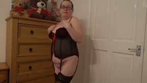 Striptease in Basque stockings and suspenders