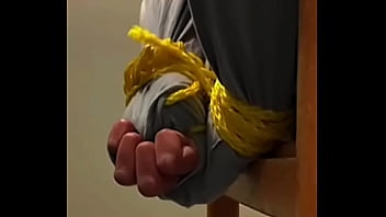 Chilean casual man&#039_s hands tied up so tightly and struggling