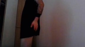 Adorable crossdresser stepping out in a stylish little black dress