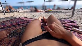 rubbing oil on my naked body at a public beach while my husband films me
