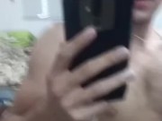 Handsome hot guy cumming in front of the mirror