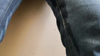 Piss outdoor into jeans
