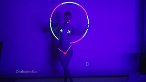 Dances And Hula Hoops Under A Black Light
