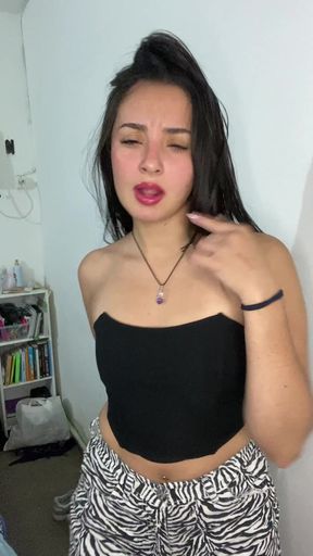 Woman in black tank top and zebra pants