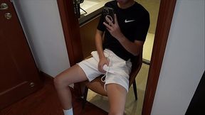 Twink boy masturbates with a cup
