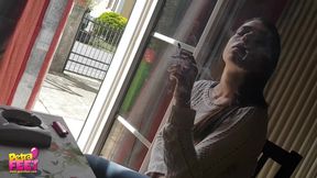 Gorgeous brunette teasing everyone with her smoking