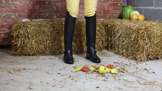 Equestrian Louisa crushing fruit wearing boots
