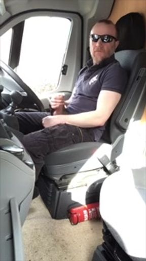 Muscular trucker jerks off and blows loads of cum over his shirt