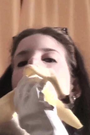 Spex brunette talking dirty while eating banana