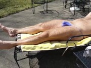 Sunning in a purple thong bikini where my neighbors can see