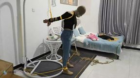 The girl in the short boots has her hand straight out and tied behind her back, with her mouth covered (Chinese Model)