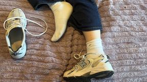 Anthony removes Amelie’s sneakers while she is resting