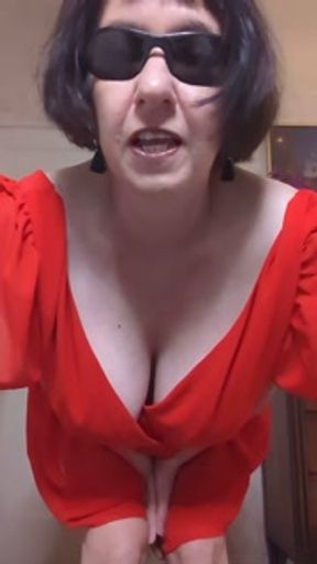 Teasing in red dress and shades