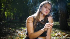Seductive Russian Beauty Smoking Cigarette in Studio