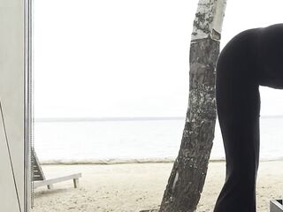 sexy goddess stretching yoga by the sea