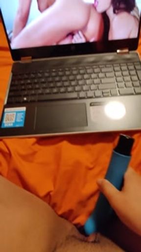 Watching lesbian porn while masturbating my wet pussy