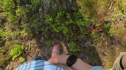 Hairy guy and his uncut friend pee on the side of road in woods next to Tesla car. Outdoor pissing