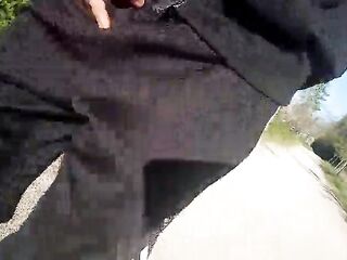 Freeballing in public, this twink walks outdoors commando, no underclothes beneath his black Adidas tracksuit, Campus sneakers, while out cruising