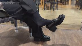 Amelie waiting to go into a meeting and gets an itchy foot