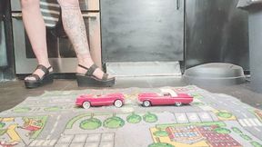 MissaRaeBerry toy car crush she cruses a 2 old cars in high black wedges close ground view
