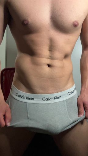 Young hunk strokes his cock in boxers and balaclava