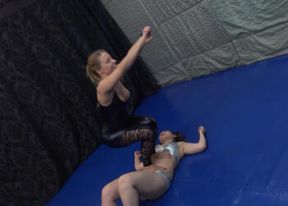 Amazing muscle MILF Nikki lifts up her rival in trampling round on the mat