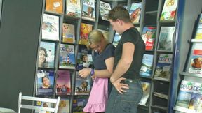 Blonde fucking a guy in a book store