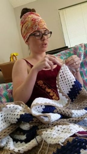 Creature crocheting and singing a tune