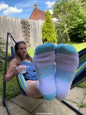 Cute girl in ankle socks enjoys outdoor fun