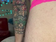 Cute Butch in harness with a glass dildo
