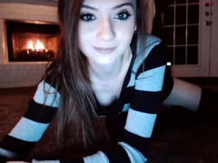 Attractive brunette teenager doing a solo striptease act