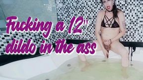 Trans takes a 12" dildo in her ass in a jacuzzi