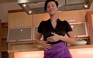 Perfect babe strips and masturbates in the kitchen