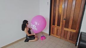 Marianna blows to pop her big pink TIFFANY balloon!