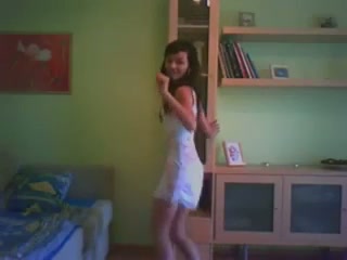Dark haired slender amateur chick dances in her white dress for me