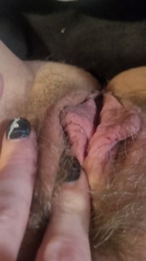 Pussy lip pushed through hole in pants, playing with pussy